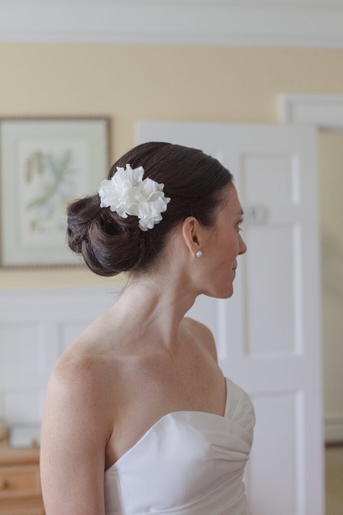 Close up detail of flower accessory in bride's hair. Vermont Wedding Photographer Deborah Zoe Photography