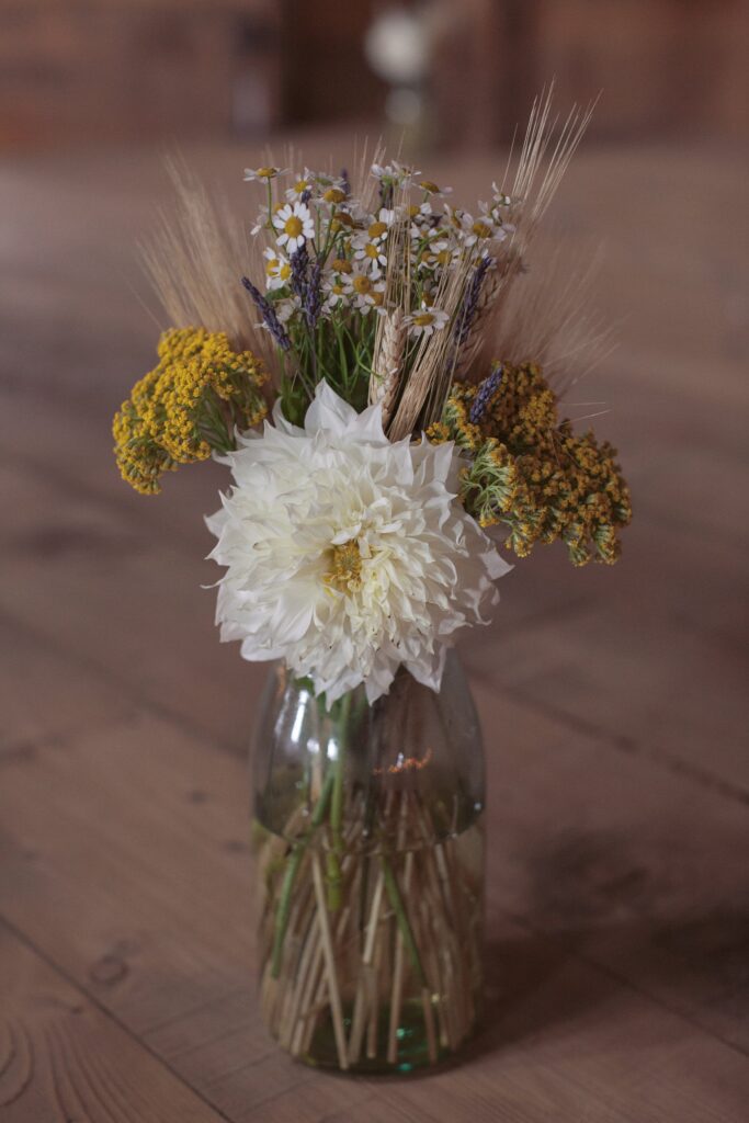 Wild flowers in vase as ceremony decor. Vermont Wedding Photographer Deborah Zoe Photography