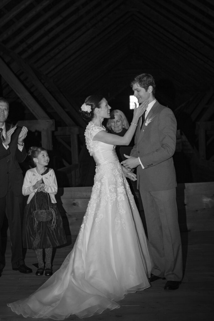 Bride gently touches face of groom during wedding ceremony. Vermont Wedding Photographer Deborah Zoe Photography