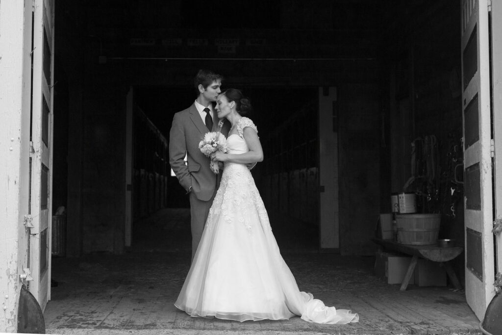 Bride and Groom kiss during wedding portrait. Vermont Wedding Photographer Deborah Zoe Photography