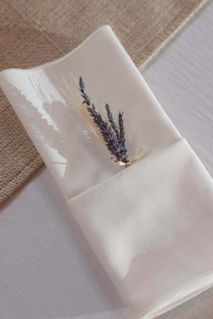 Lavander tucked into napkin for wedding table decor. Vermont Wedding Photographer Deborah Zoe Photography