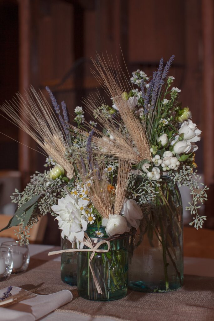 Dinner reception flower decor. Vermont Wedding Photographer Deborah Zoe Photography