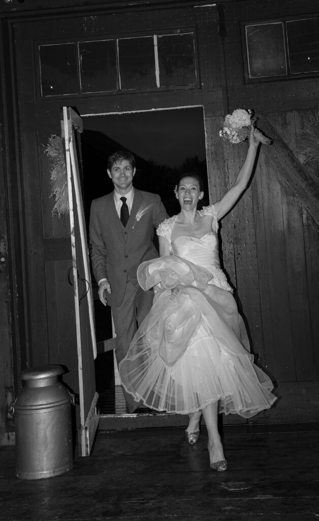 Bride and Groom walk into wedding reception with excited reactions. Vermont Wedding Photographer Deborah Zoe Photography