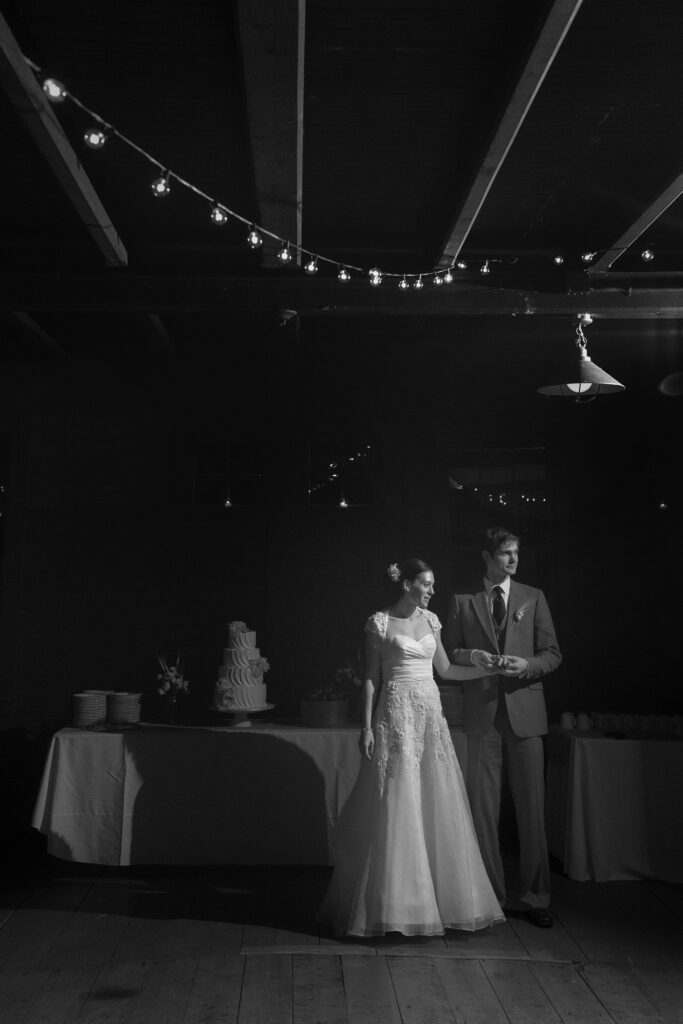 Couple hold hands before their first dance. Vermont Wedding Photographer Deborah Zoe Photography