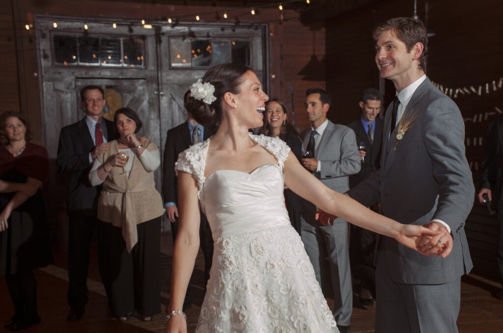 Bride and Groom dance and smile during wedding reception. Vermont Wedding Photographer Deborah Zoe Photography