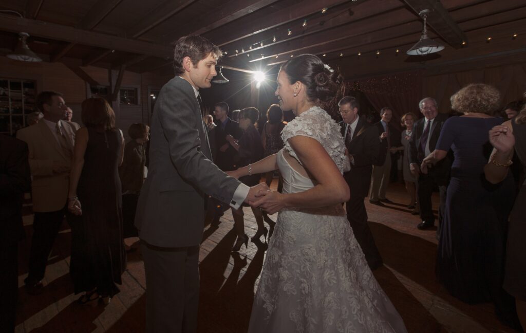 Bride and Groom dance and smile during wedding reception. Vermont Wedding Photographer Deborah Zoe Photography