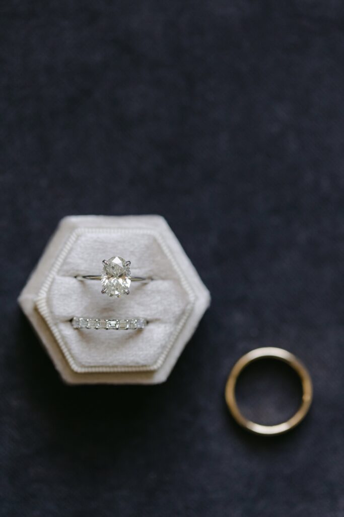 Wedding rings in a box. Modern Summer Wedding at the Newbury Boston Hotel photographed by Deborah Zoe Photography. 